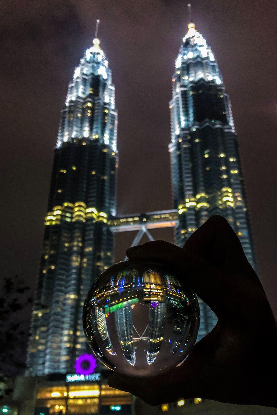 person holding clear glass ball